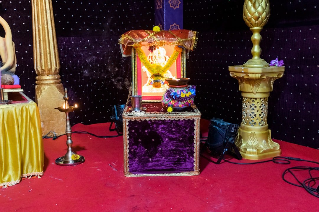 Decorated home altar with deity idol and floral offerings for Janmashtami